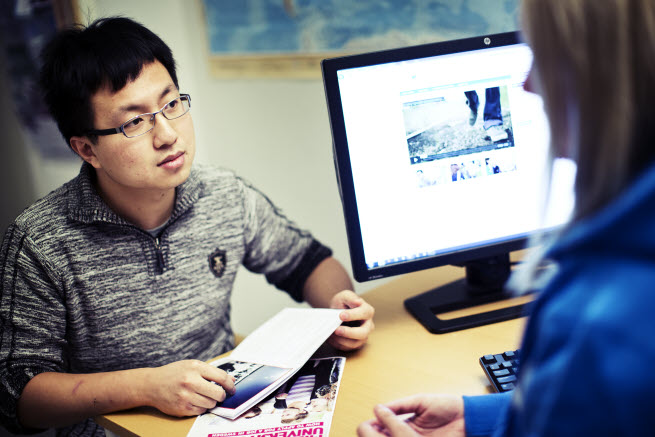 Student and staff having a conversation, photo