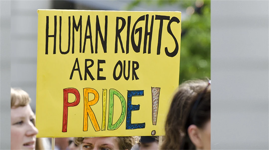 Placard in pride parade with the text "Human rights are our pride".