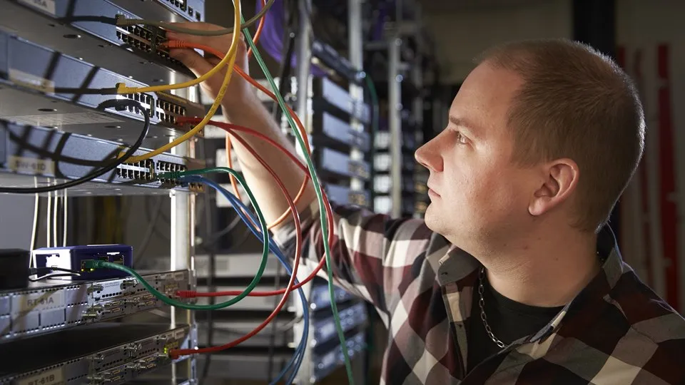 A man in a server room.